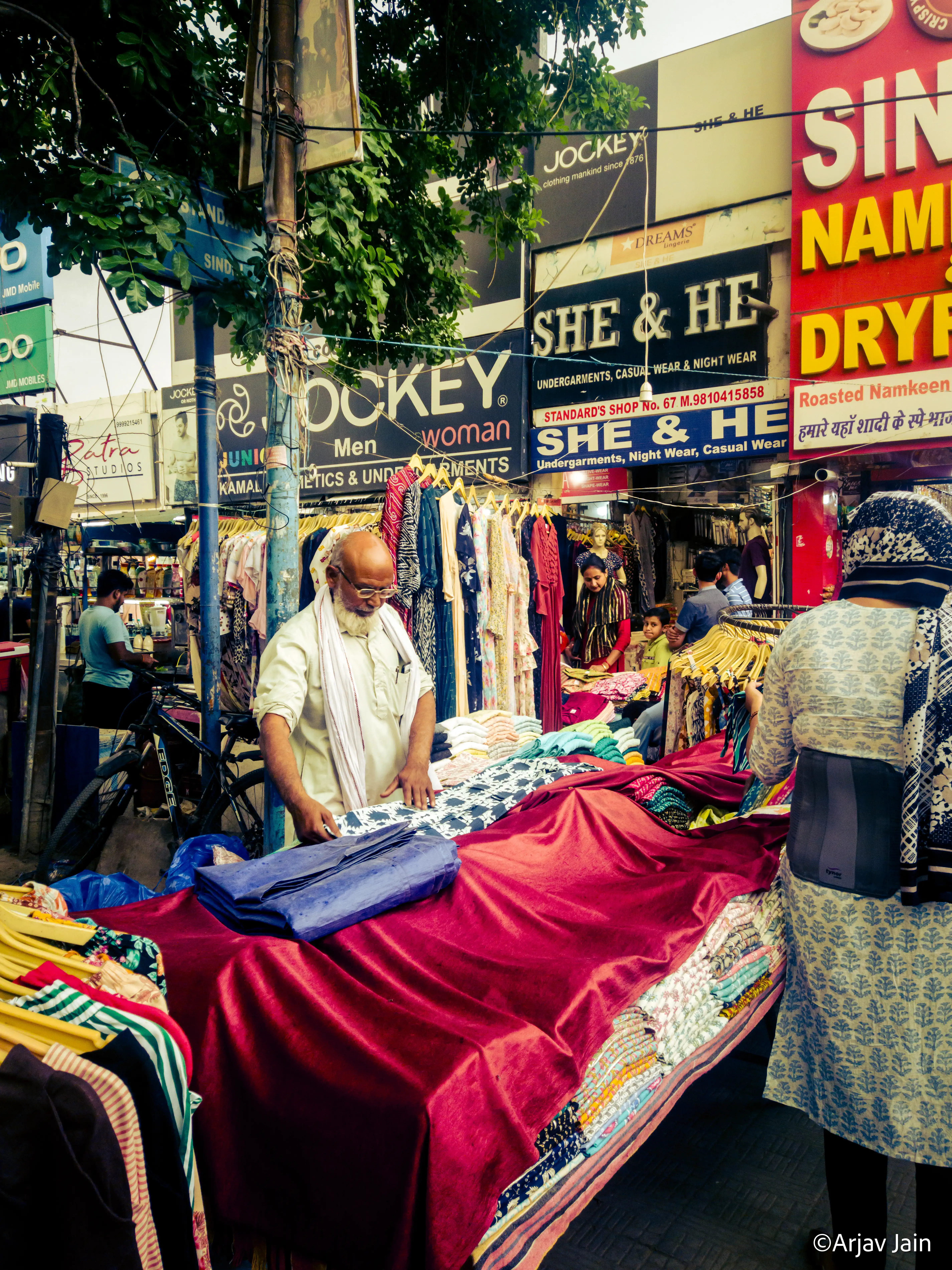 picture of a street vendor selling clothes